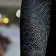 Top Arm Blackout Tattoo Ideas & Designs | Meaningful Tattoos: Symbols with Deep Personal Significance