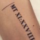 Top 10 Roman Numeral Tattoo Ideas & Designs | Meaningful Tattoos: Symbols with Deep Personal Significance